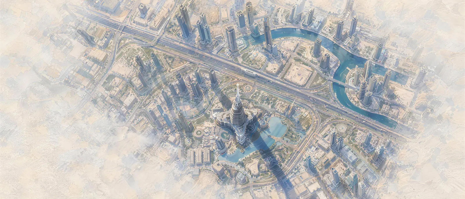 Downtown Dubai seen from straight above the Burj Khalifa: roads and canals run through the city like wires on a circuit board.